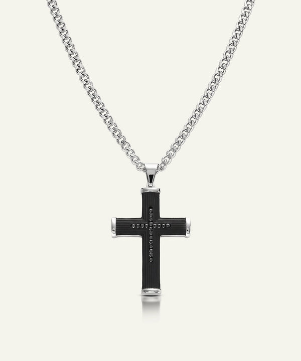Black cross pendant necklace on a white background