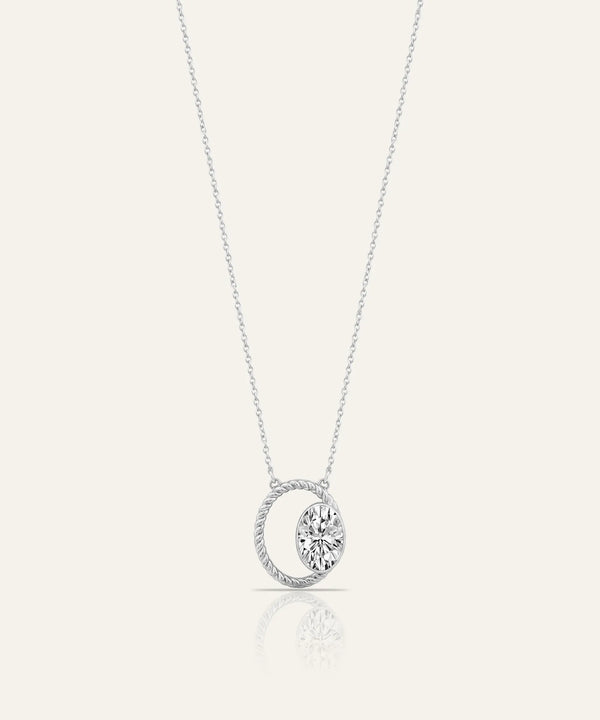 Silver necklace with two diamond pendants on a white background