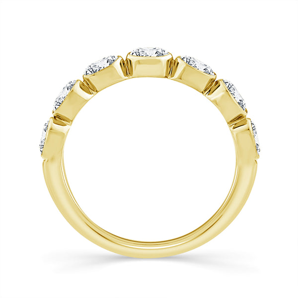 A yellow gold eternity-style ring with a row of small clear gemstones set along the band, shown on a clean white background.