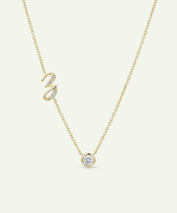 Gold necklace with a swan-shaped pendant on a light beige background