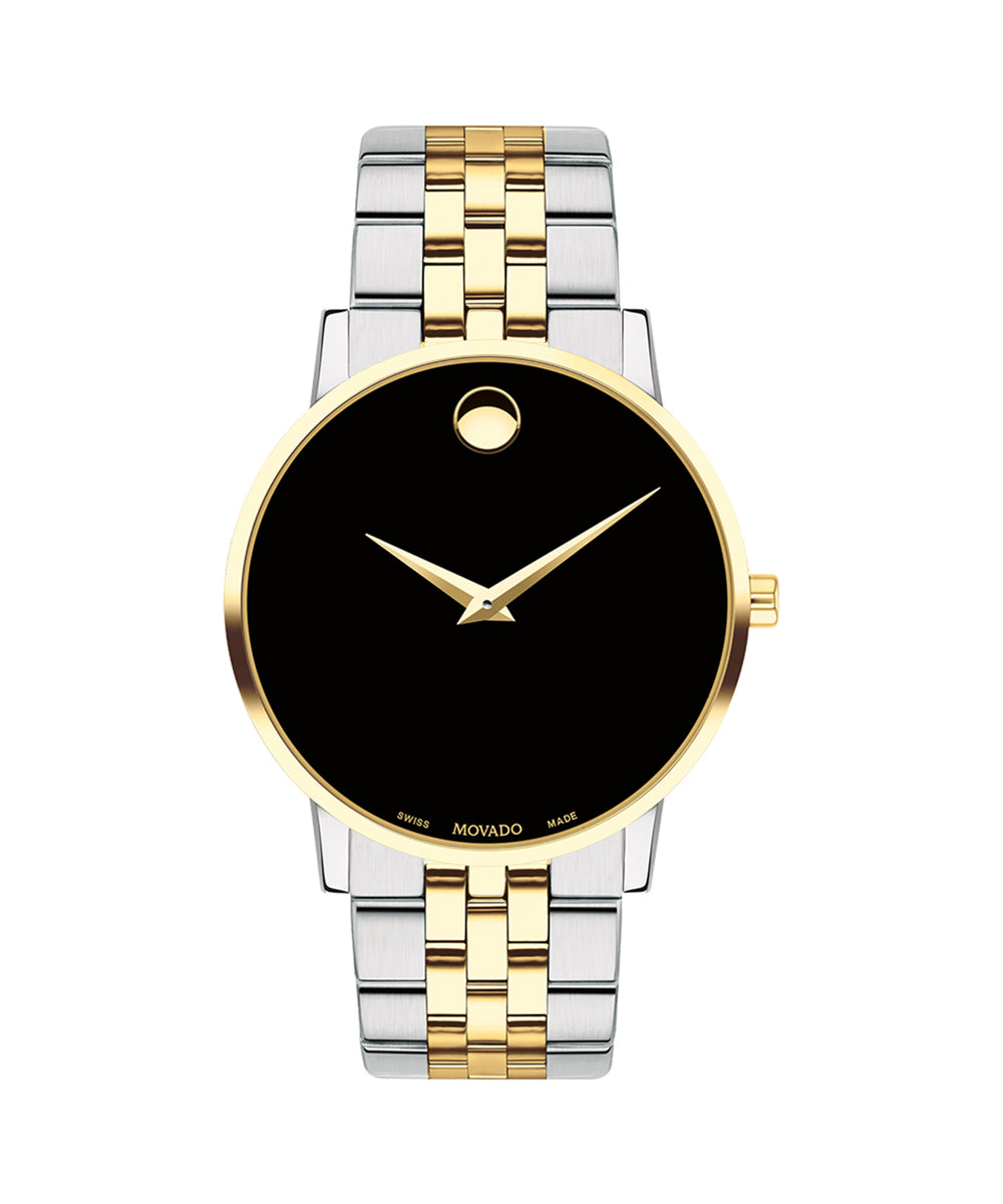 Two-tone watch with gold and silver straps on a white background