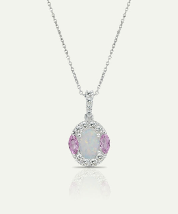 Silver pendant with pink gemstone and chain on a white background