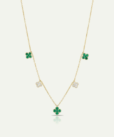 Gold necklace with green clover pendants on a white background