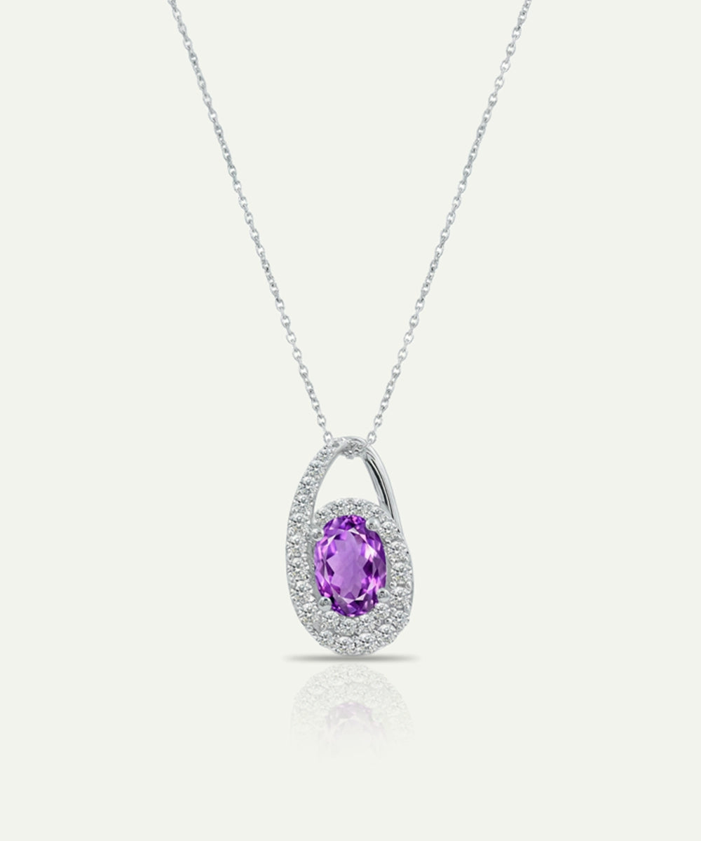 Silver necklace with a purple gemstone pendant on a white background