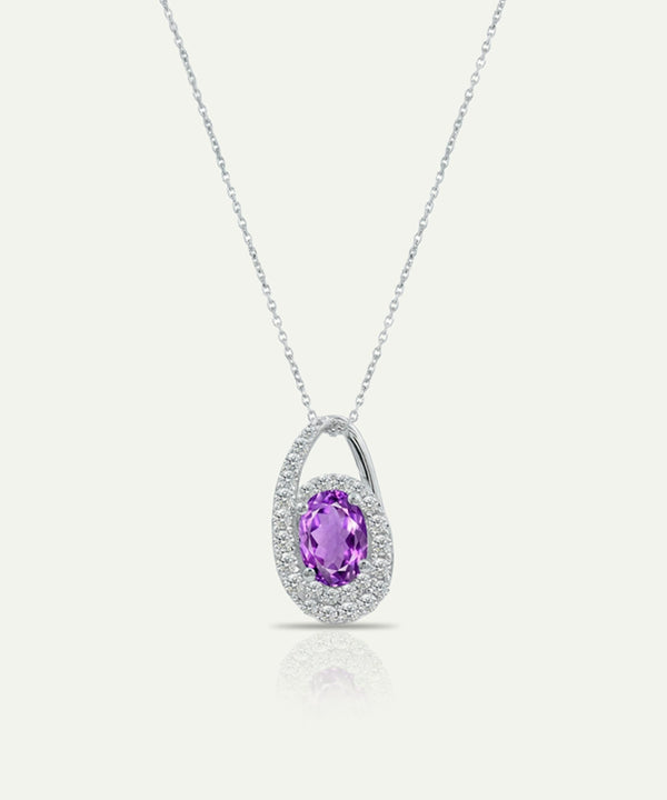 Silver necklace with a purple gemstone pendant on a white background