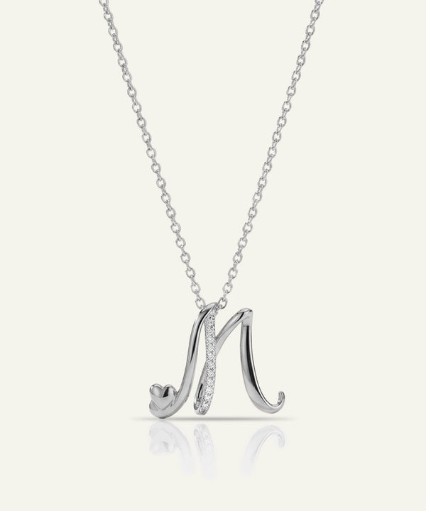 Silver necklace with a 'M' pendant on a white background