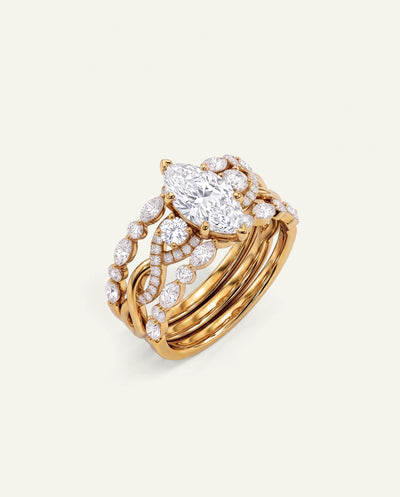 A gold ring with a large marquise-cut diamond center stone and multiple curved bands set with round and oval diamonds, photographed on a clean off-white background. - alternate view