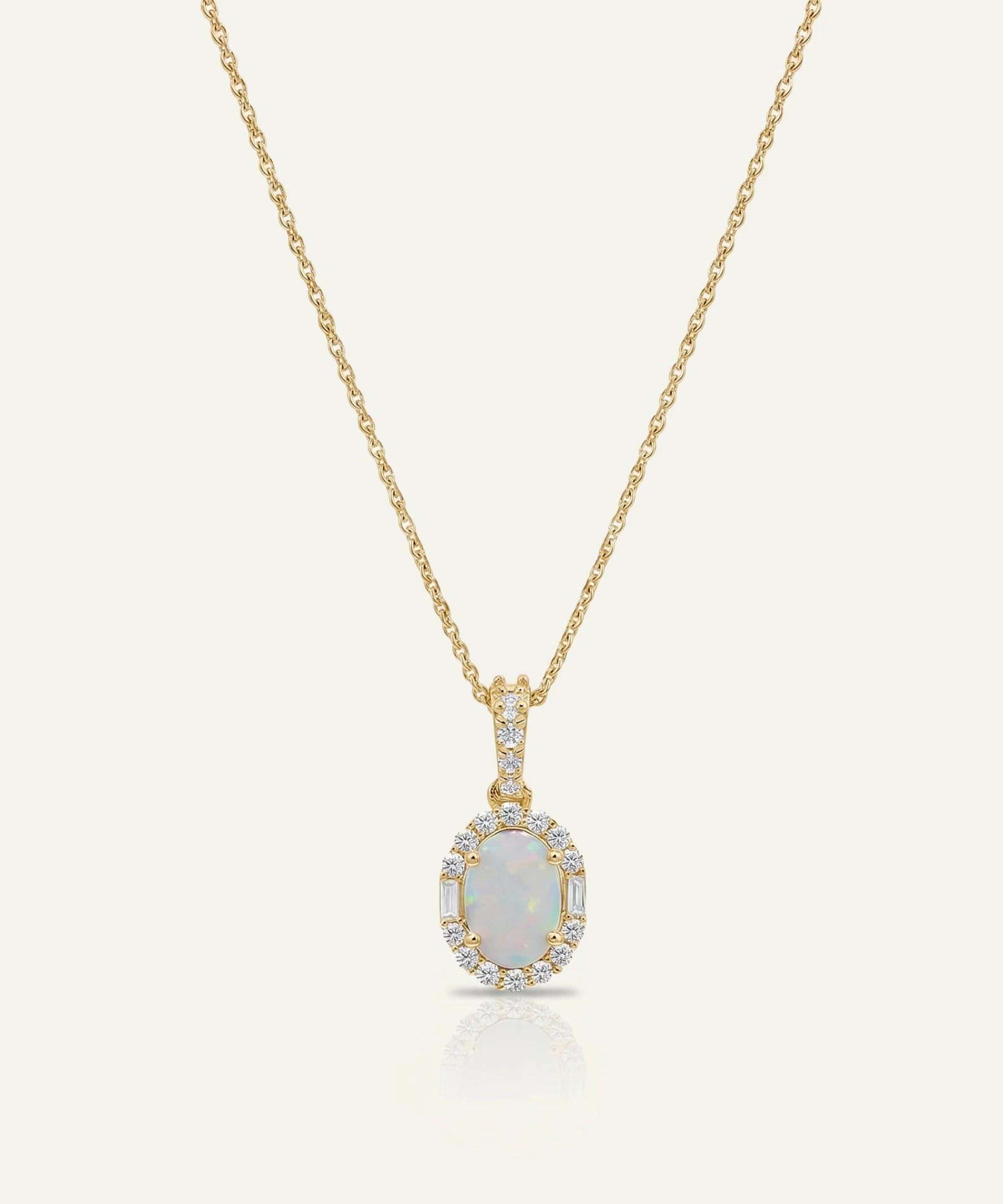 Gold necklace with a pendant on a white background