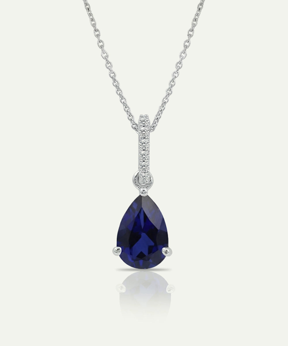 Sapphire pendant necklace on a white background