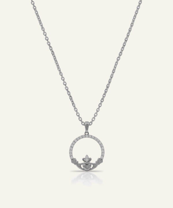 Silver claddagh pendant necklace on a white background