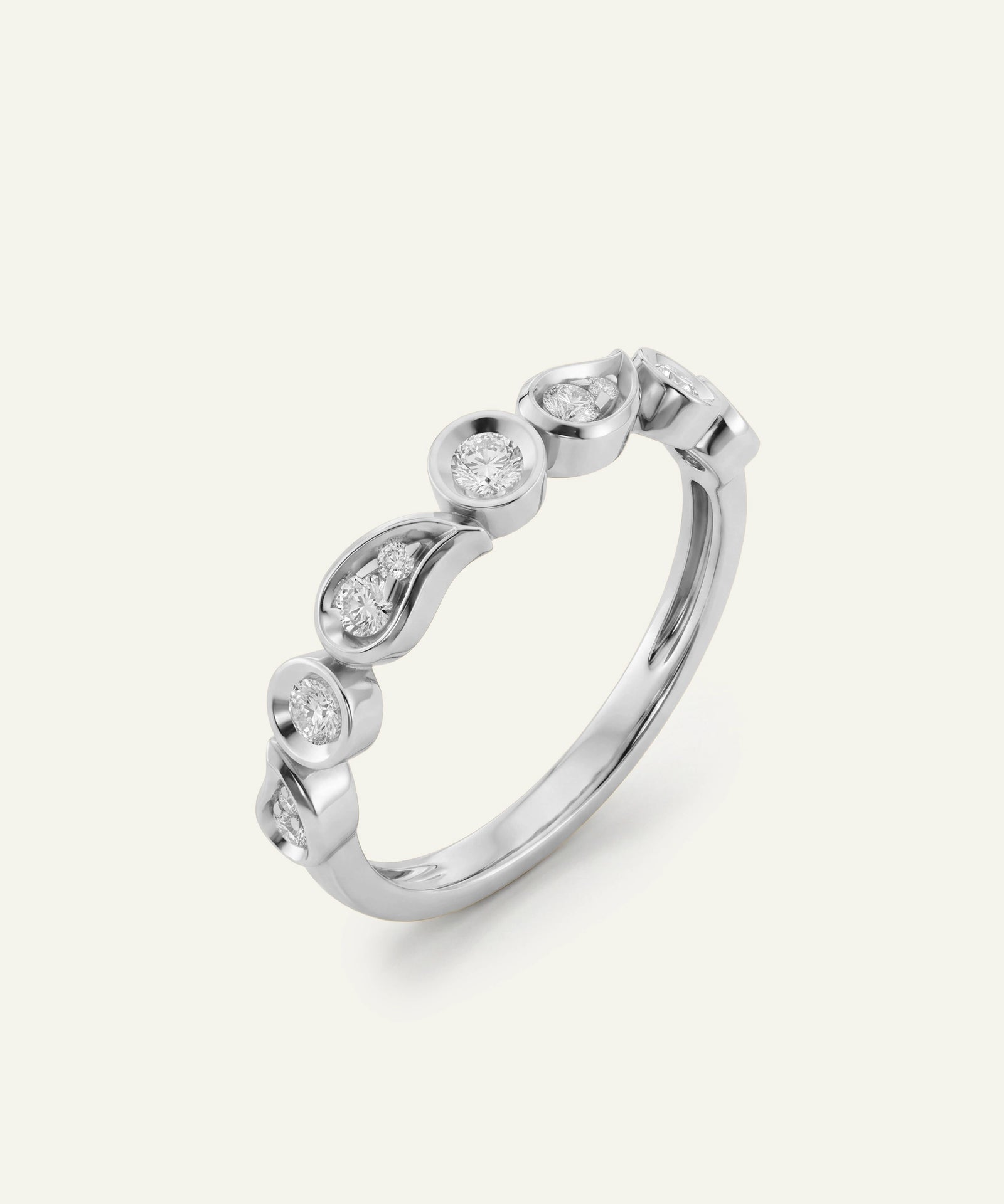 A silver-toned diamond band ring featuring a series of small round and marquise-cut diamonds set along the top curve, photographed on a clean, light off-white background.