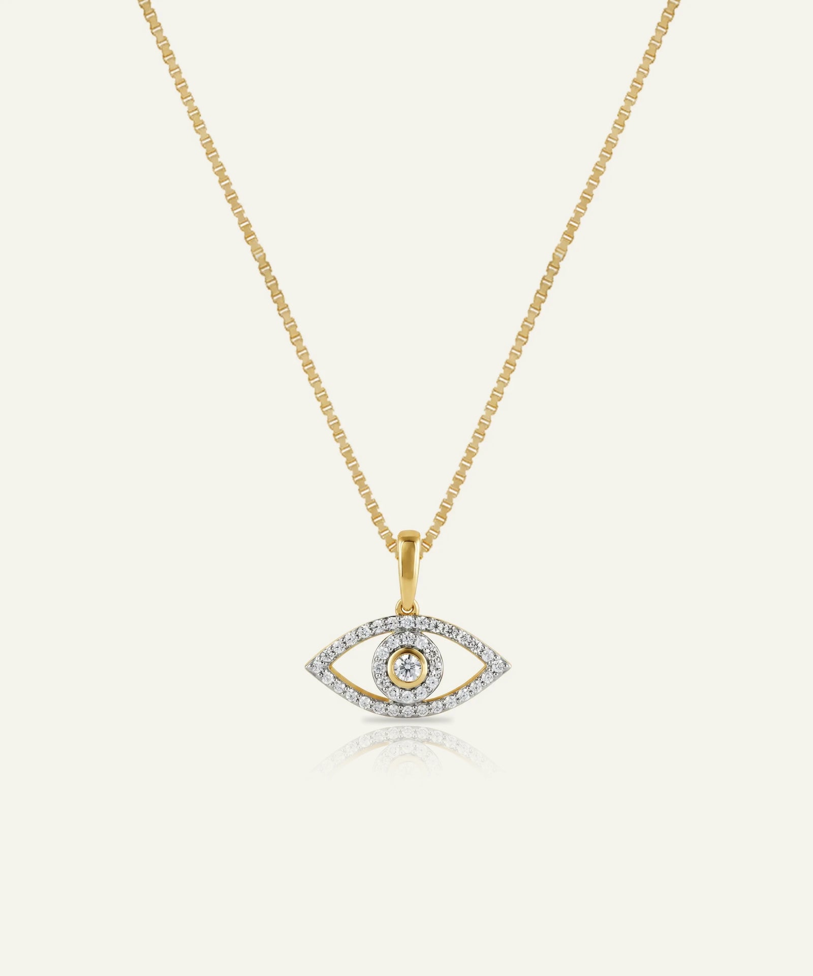 Gold necklace with an eye-shaped pendant on a white background