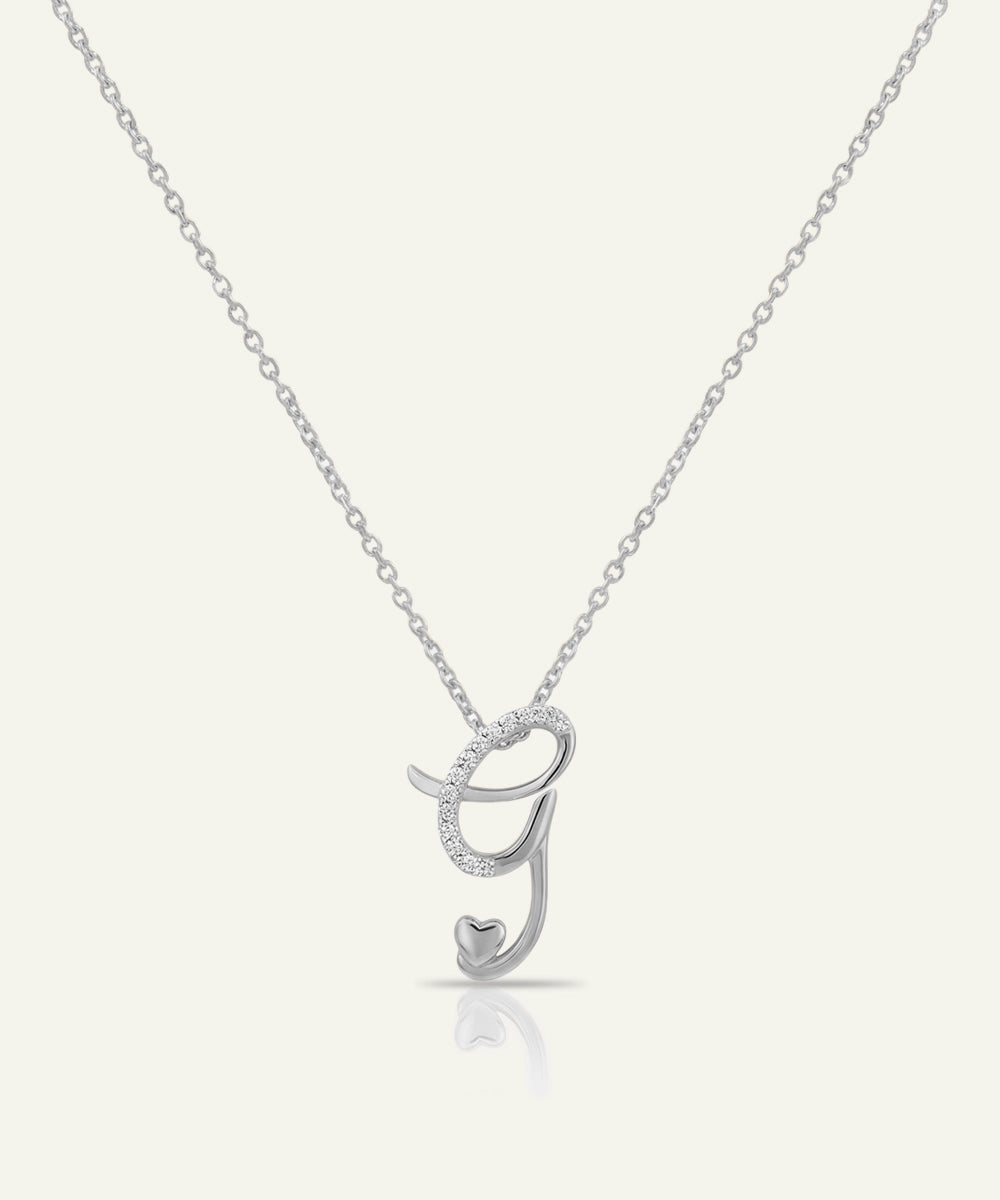Silver necklace with a letter 'J' pendant on a white background