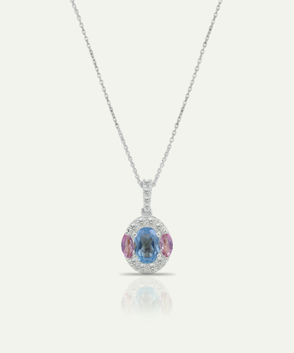 Necklace with a pendant featuring a blue and pink gemstone on a white background