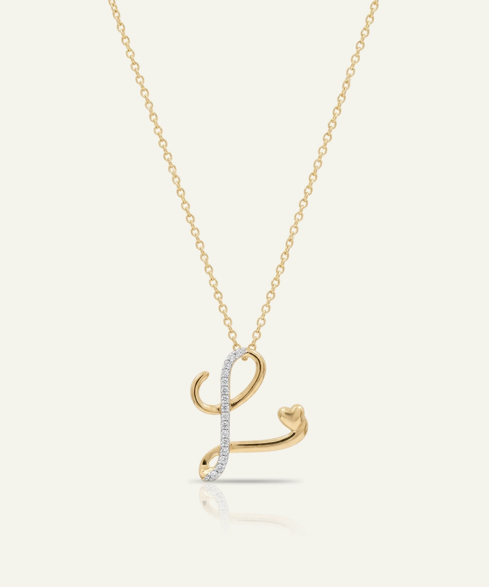 Gold necklace with a letter 'L' pendant on a white background