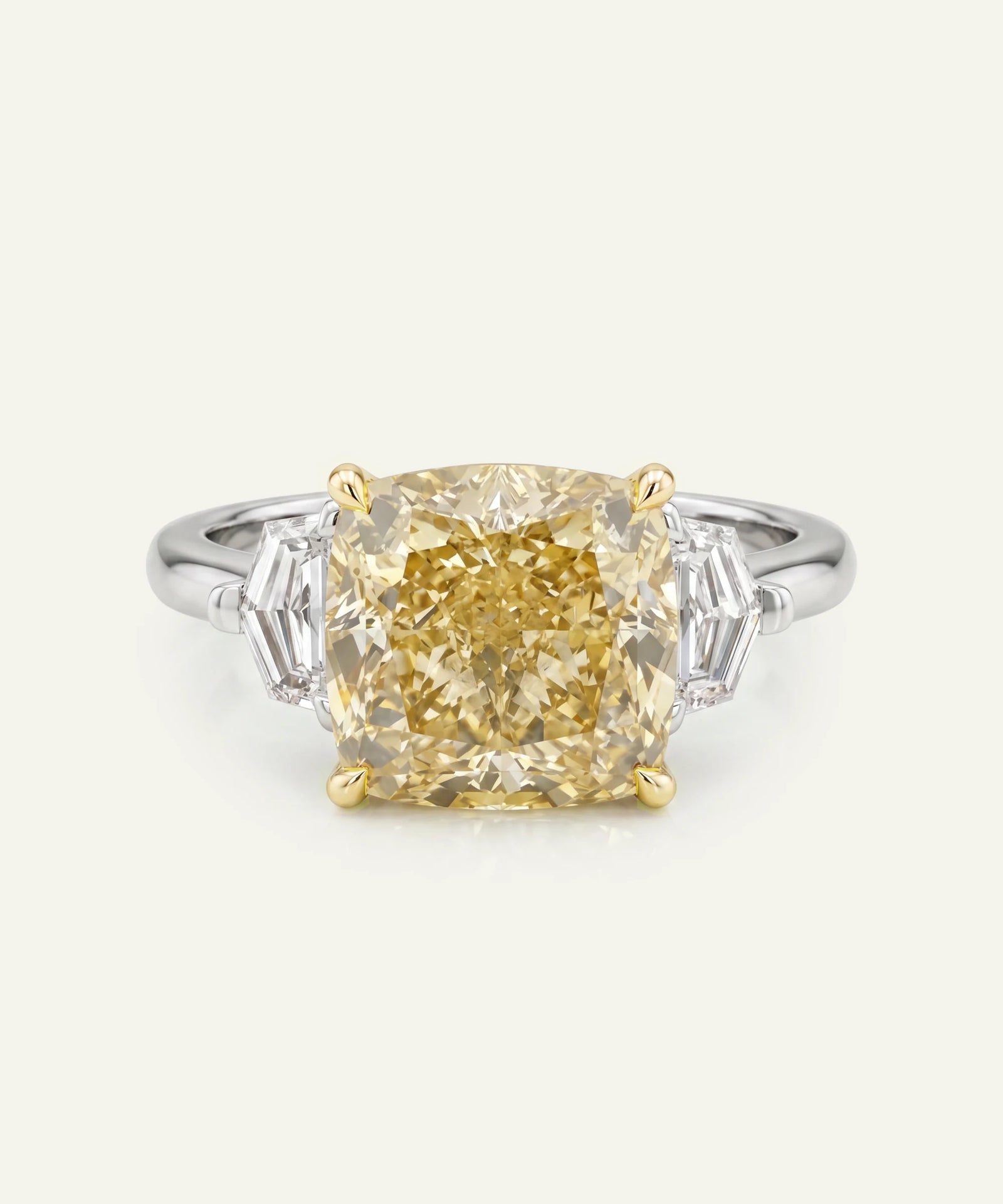 Diamond ring with a yellow gemstone on a white background