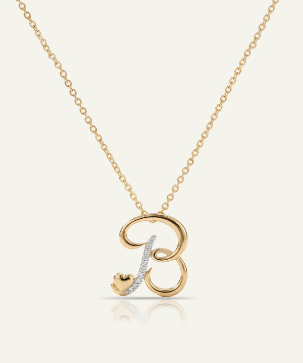 Gold necklace with a letter 'B' pendant on a white background