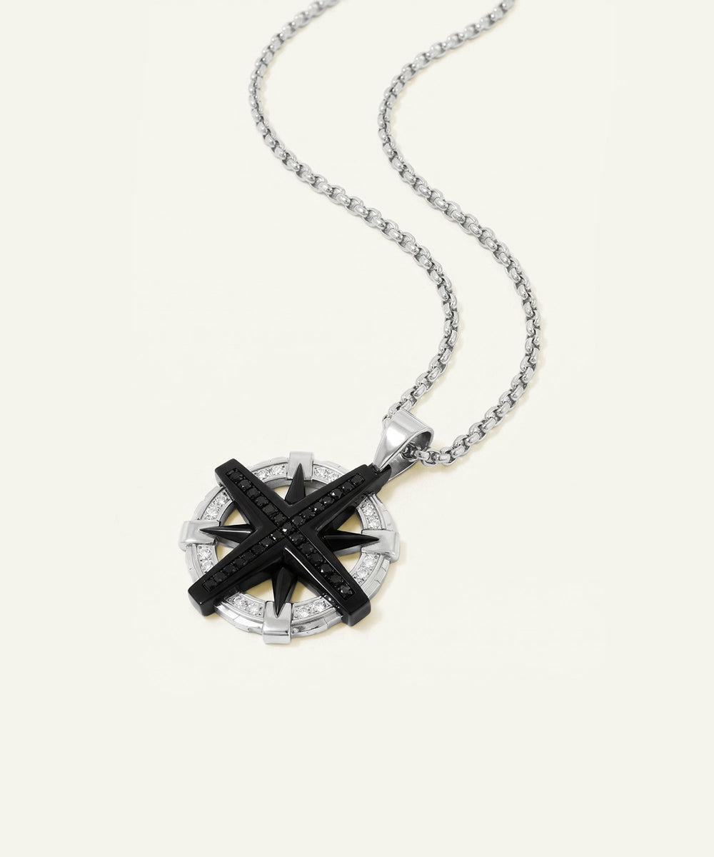 Necklace with a compass pendant on a white background