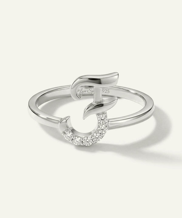 Silver ring with a small diamond on a white background