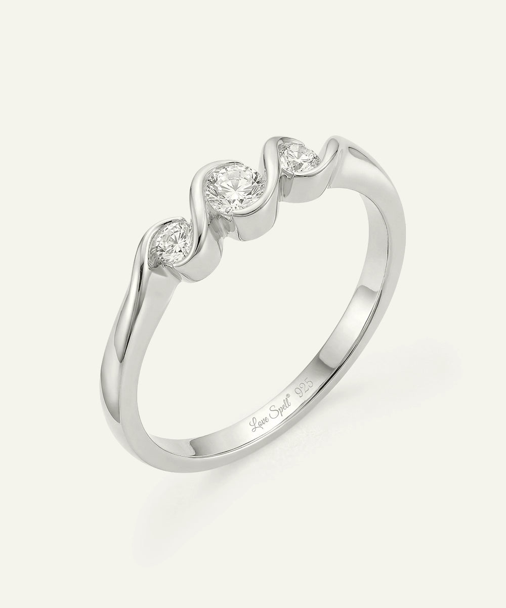 White gold open heart swirl rings displayed side by side in a direct studio view.