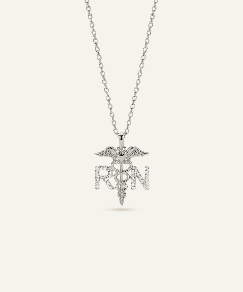 Silver necklace with a caduceus pendant and 'RN' letters on a white background