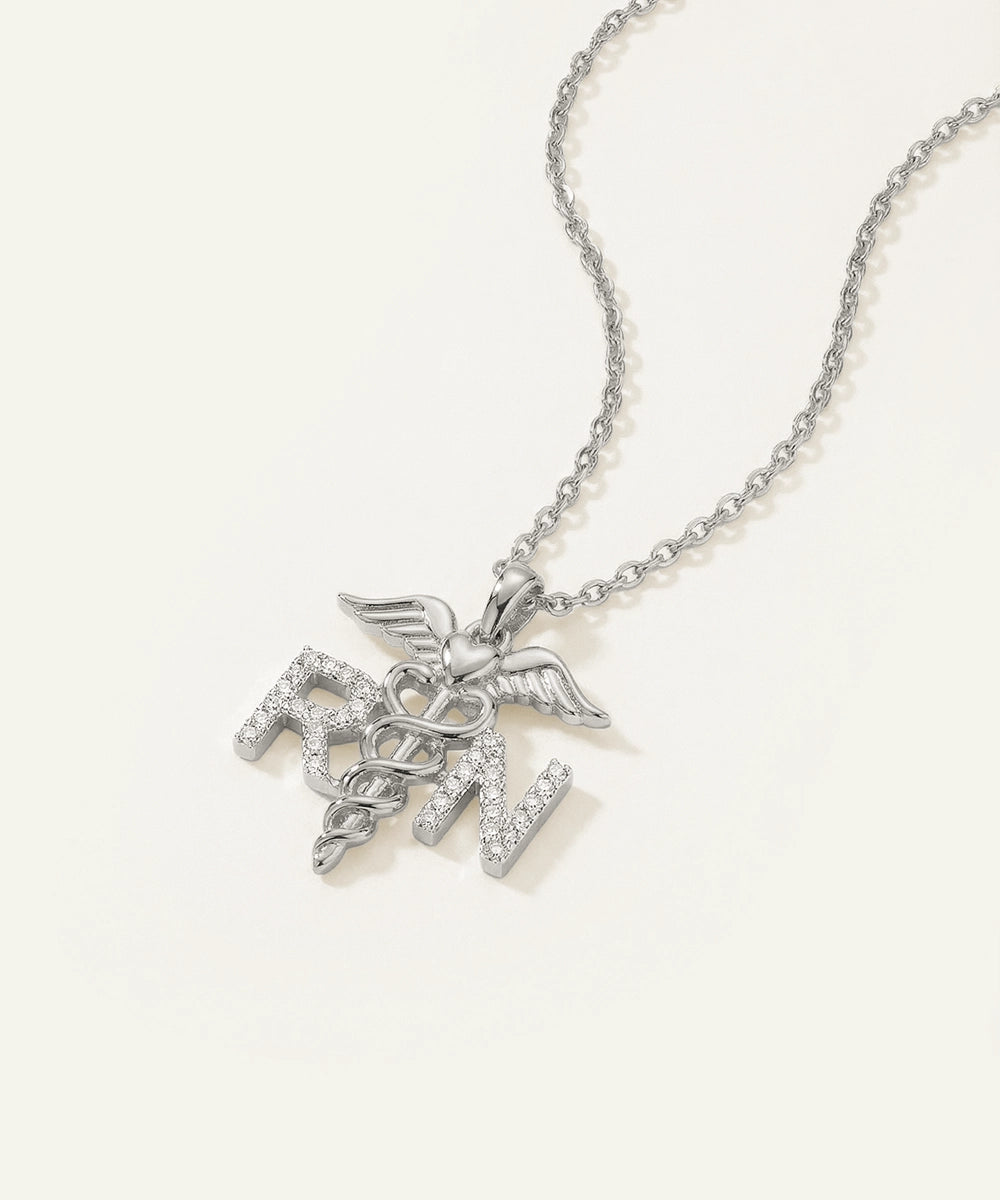 Silver necklace with a caduceus pendant on a white background