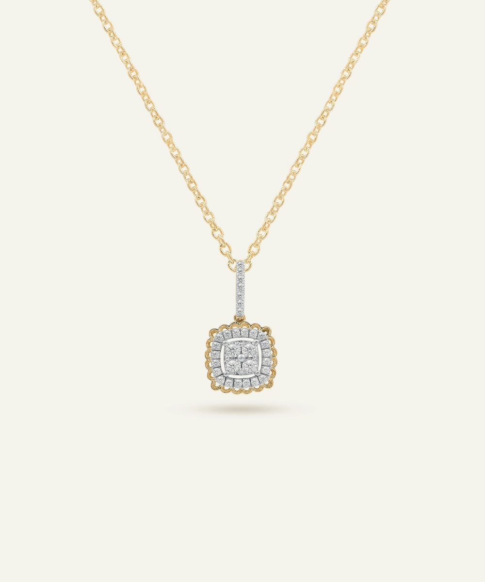 Gold necklace with a square pendant on a light beige background