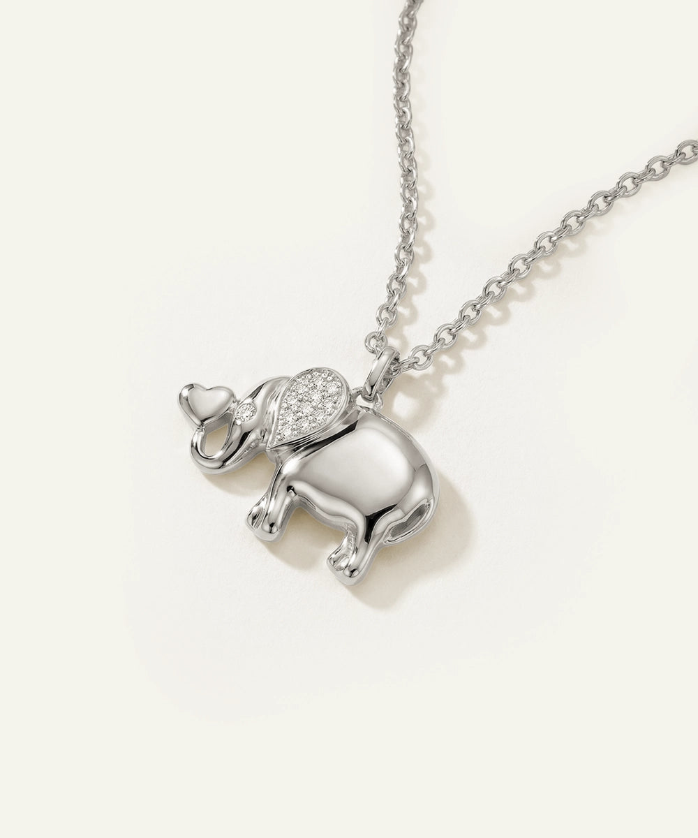 Silver elephant pendant necklace on a white background