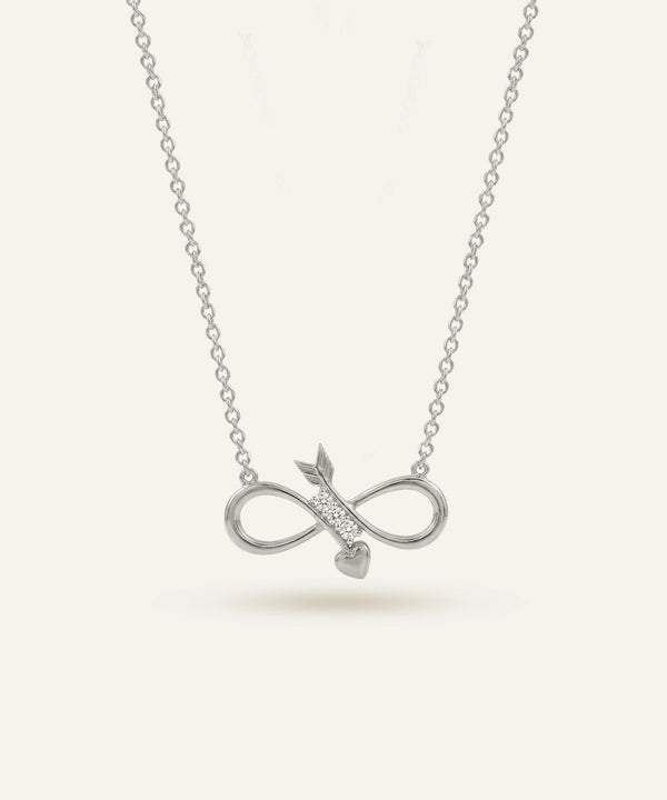 Silver necklace with an infinity symbol pendant on a light gray background