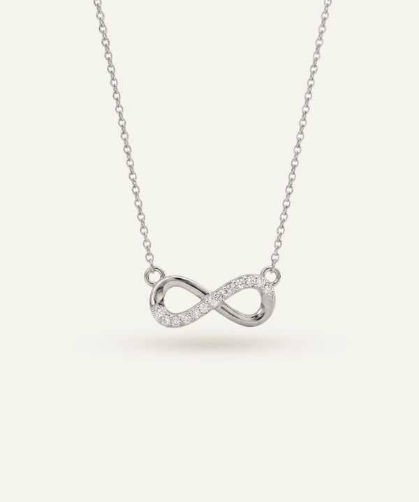 Silver infinity necklace on a white background