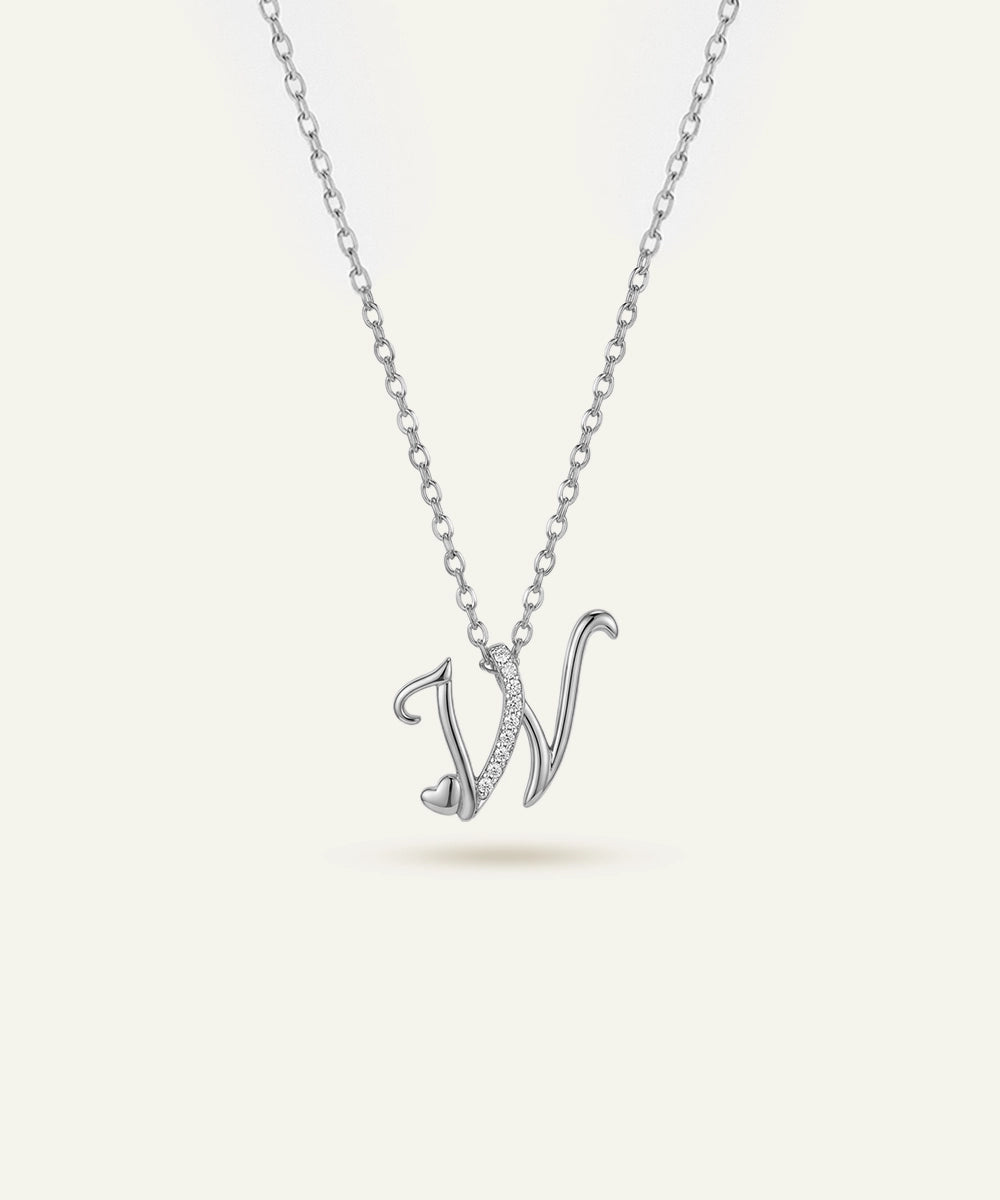 Silver necklace with a 'V' pendant on a light gray background
