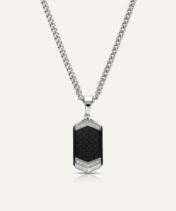 Necklace with a black pendant and silver chain on a white background