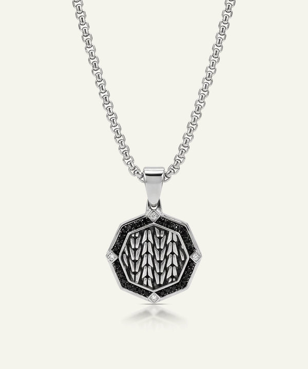 Silver necklace with a hexagonal pendant on a white background