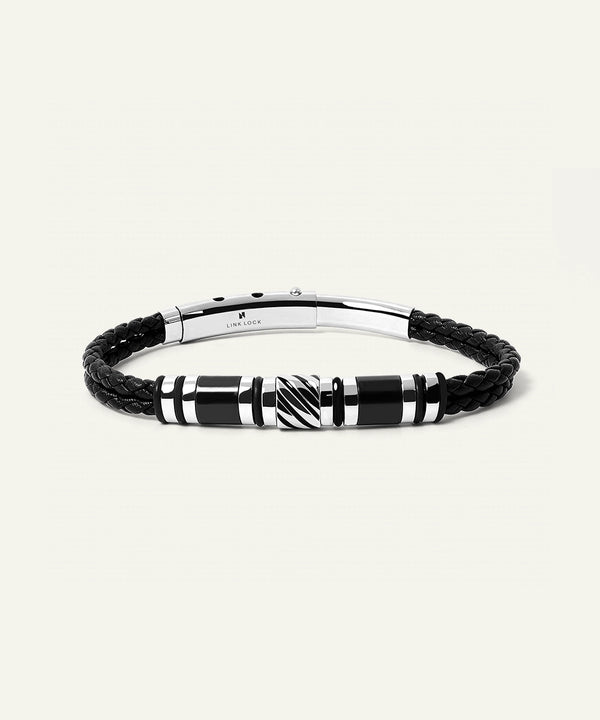 Black braided leather bracelet with a silver clasp on a white background