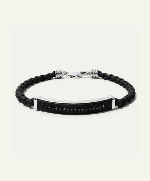 Black braided bracelet with a metal tag on a white background