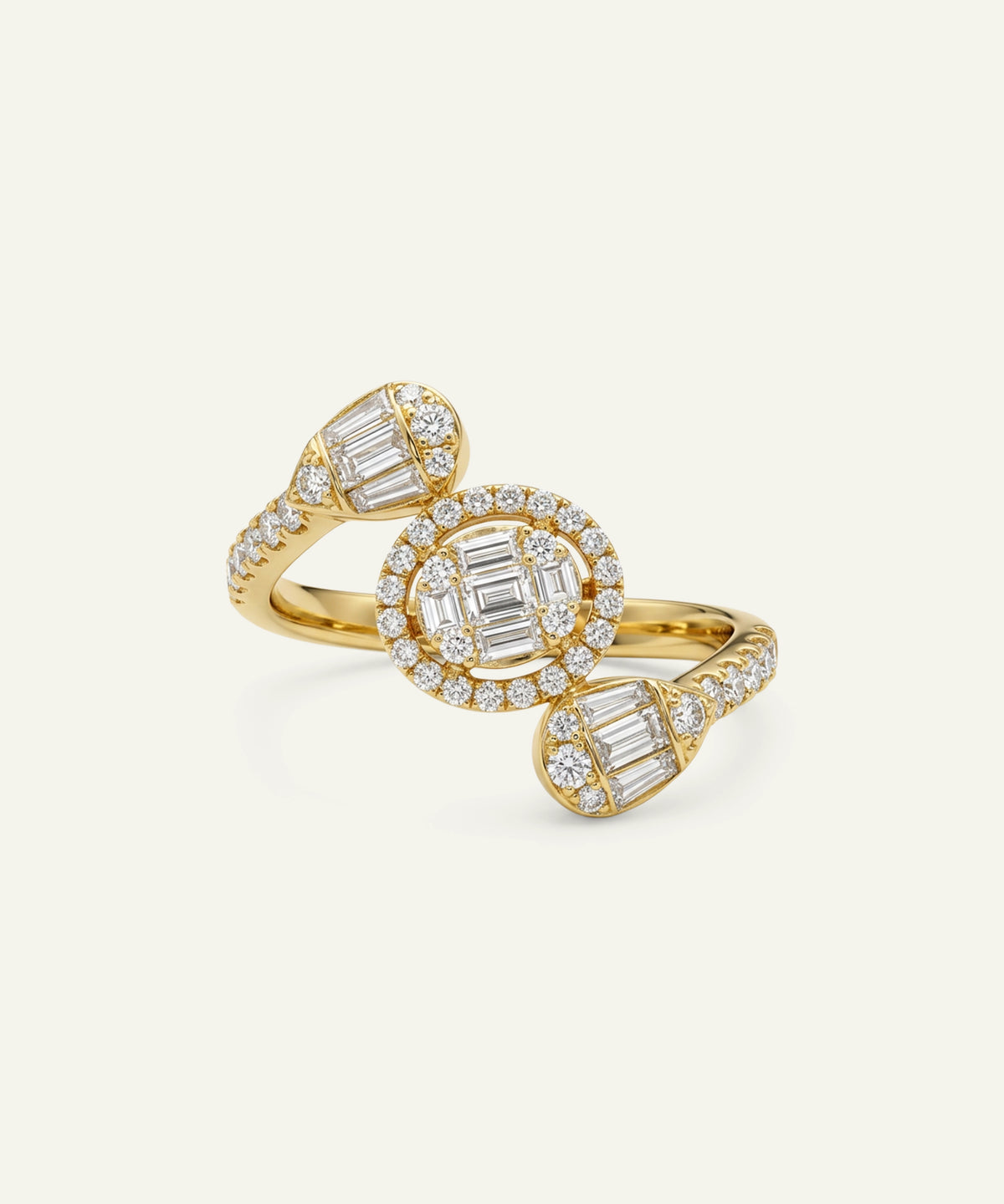 A gold ring with three oval clusters of baguette and round diamonds, photographed on a clean off-white background.