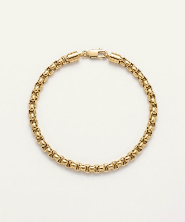 Gold chain bracelet on a white background