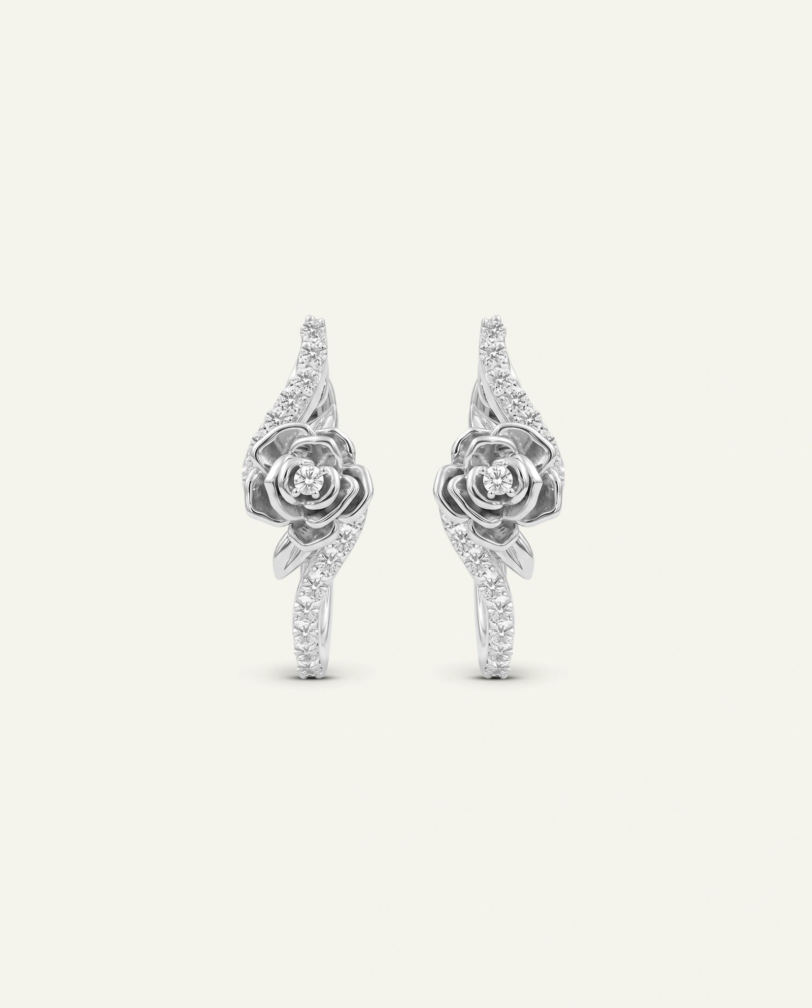 Rose gold ring with diamond butterfly design on a white background