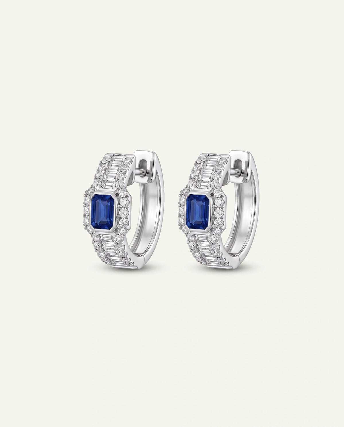 Gold stud earrings on a white background