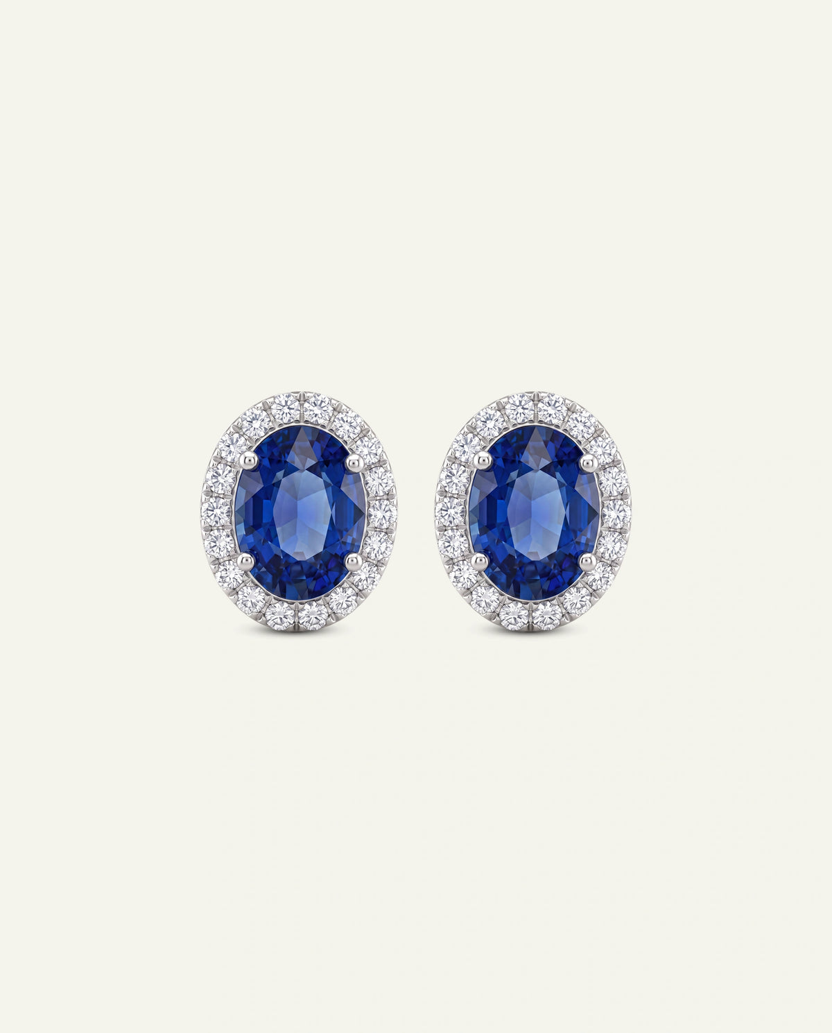 Pair of purple stud earrings on a white background