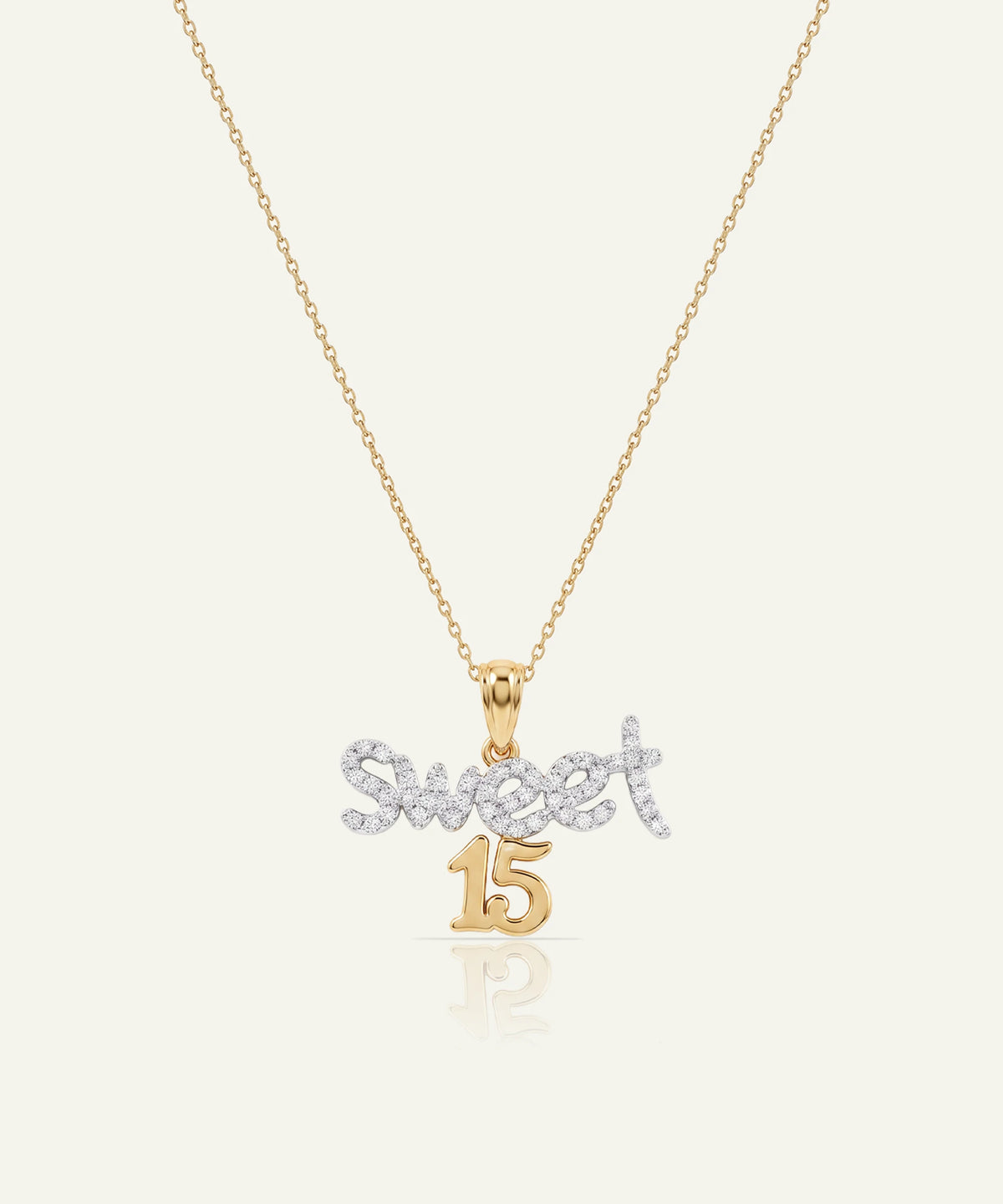 "Gold chain necklace featuring a pendant with 'Sweet 15' in diamond-paved script and gold."