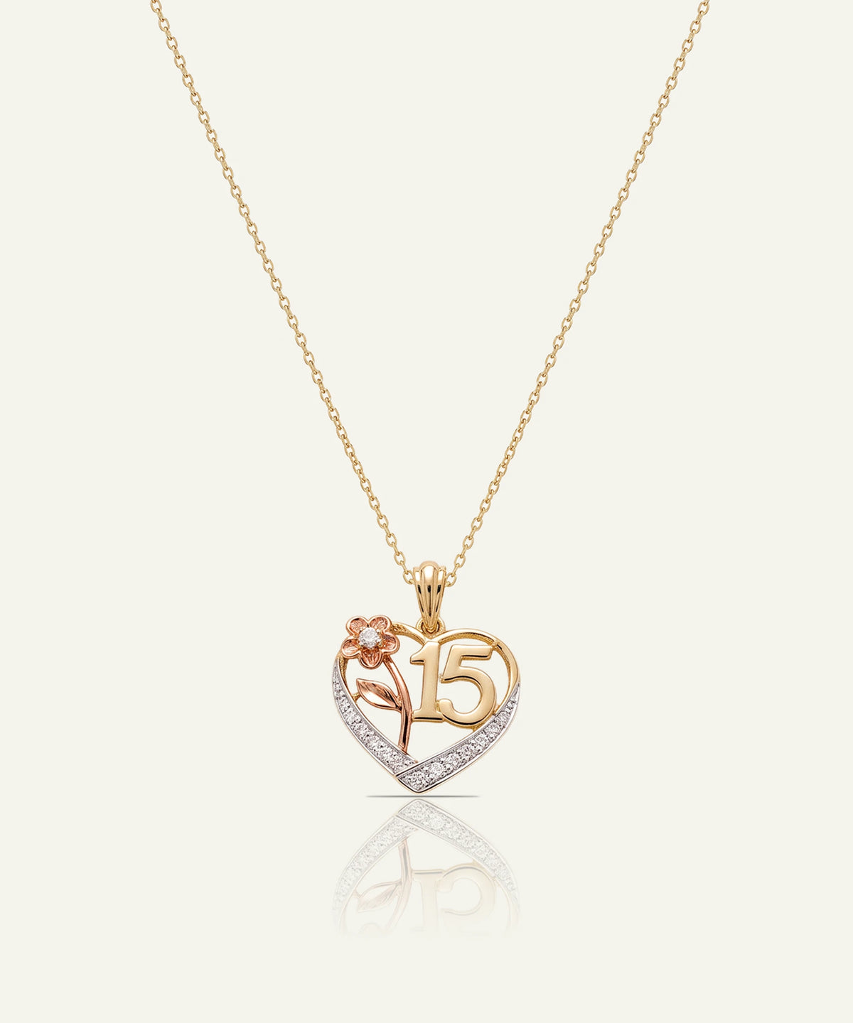"Gold chain necklace with an open-heart pendant featuring a rose gold '15' and flower motif with diamond accents."