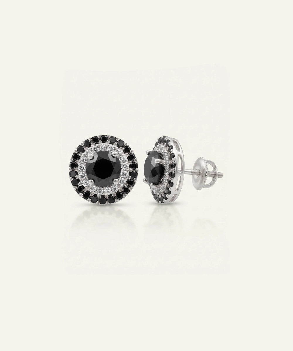 Close-up of men's black diamond cluster earrings in silver finish