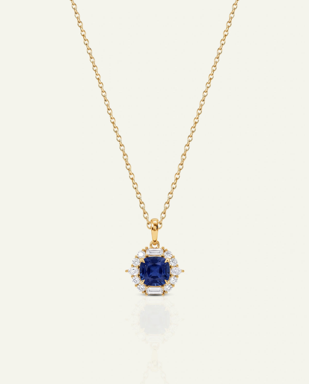 Gold necklace with a U-shaped pendant on a white background