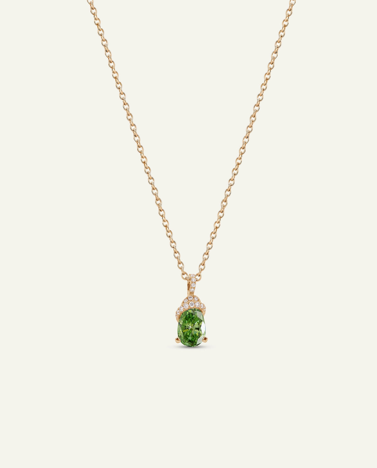 Necklace with a heart-shaped green pendant on a white background