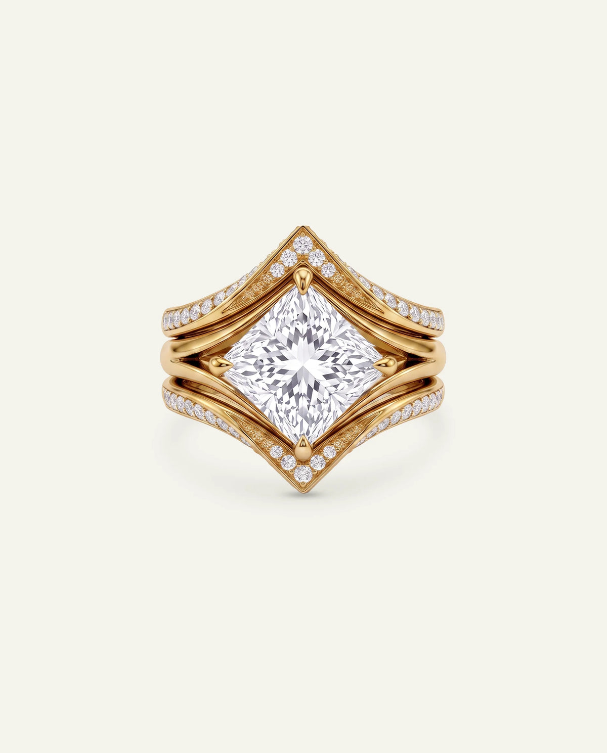 A yellow gold ring featuring a large princess-cut diamond center stone and smaller pavé diamonds along the split shank, set against a solid off-white background.