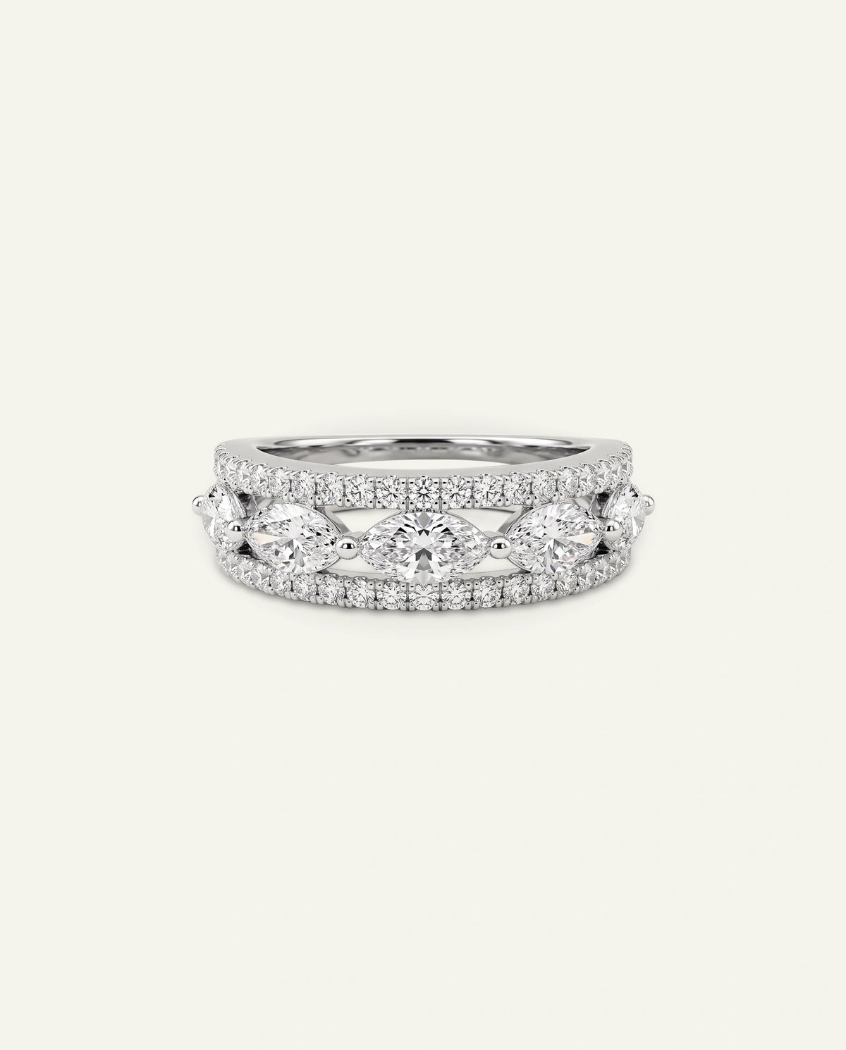 White gold multi-row diamond band with marquise-cut center stones and pave diamond borders on an off-white background.