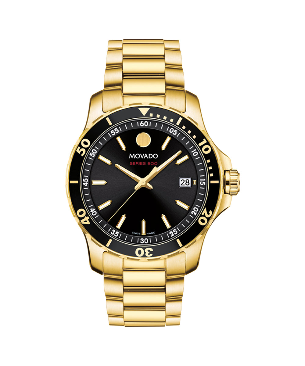 Gold wristwatch with black dial on a white background