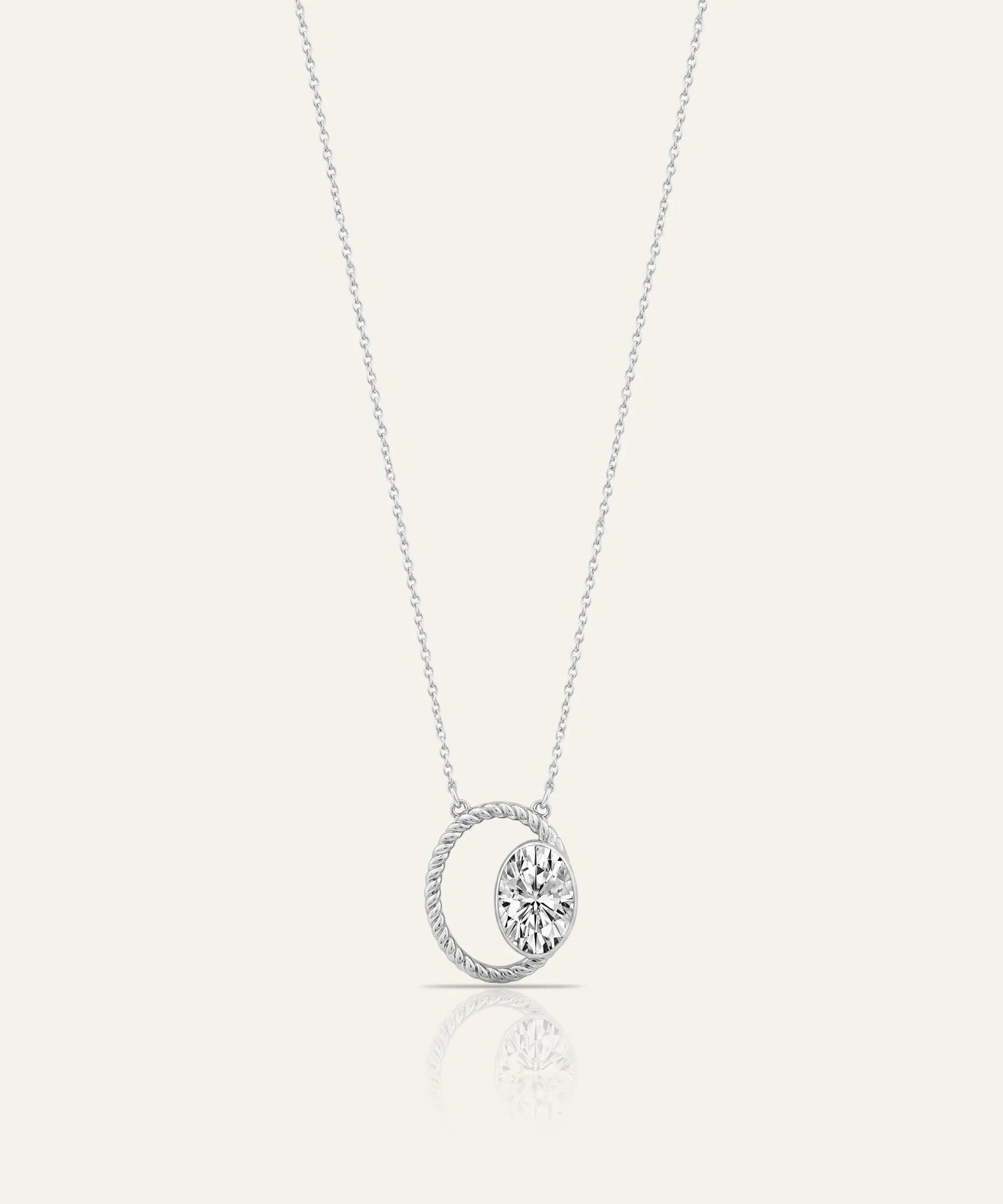 Silver necklace with two diamond pendants on a white background