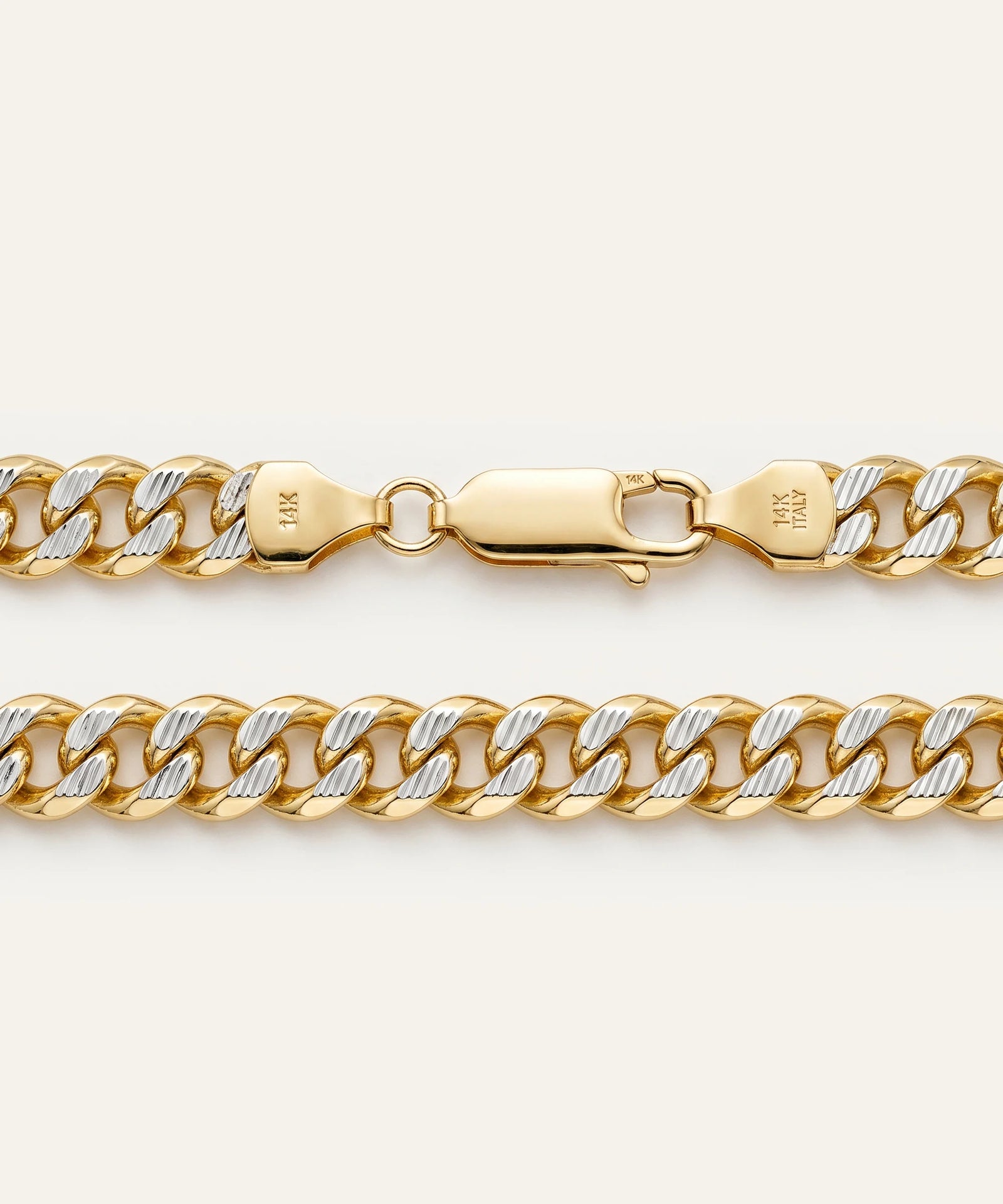 Gold chain bracelet on a white background